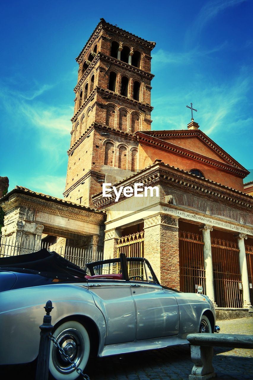 Low angle view of church against blue sky