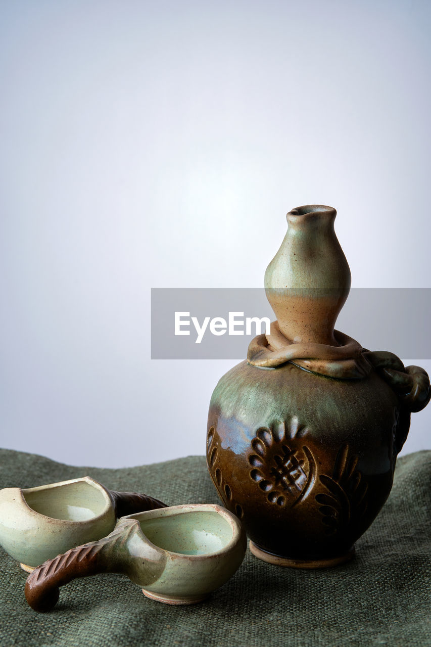 ceramic, art, pottery, studio shot, indoors, craft, porcelain, still life, teapot, no people, tableware, household equipment, container, kitchen utensil, jug, food and drink, crockery, still life photography, simplicity, history, pitcher - jug