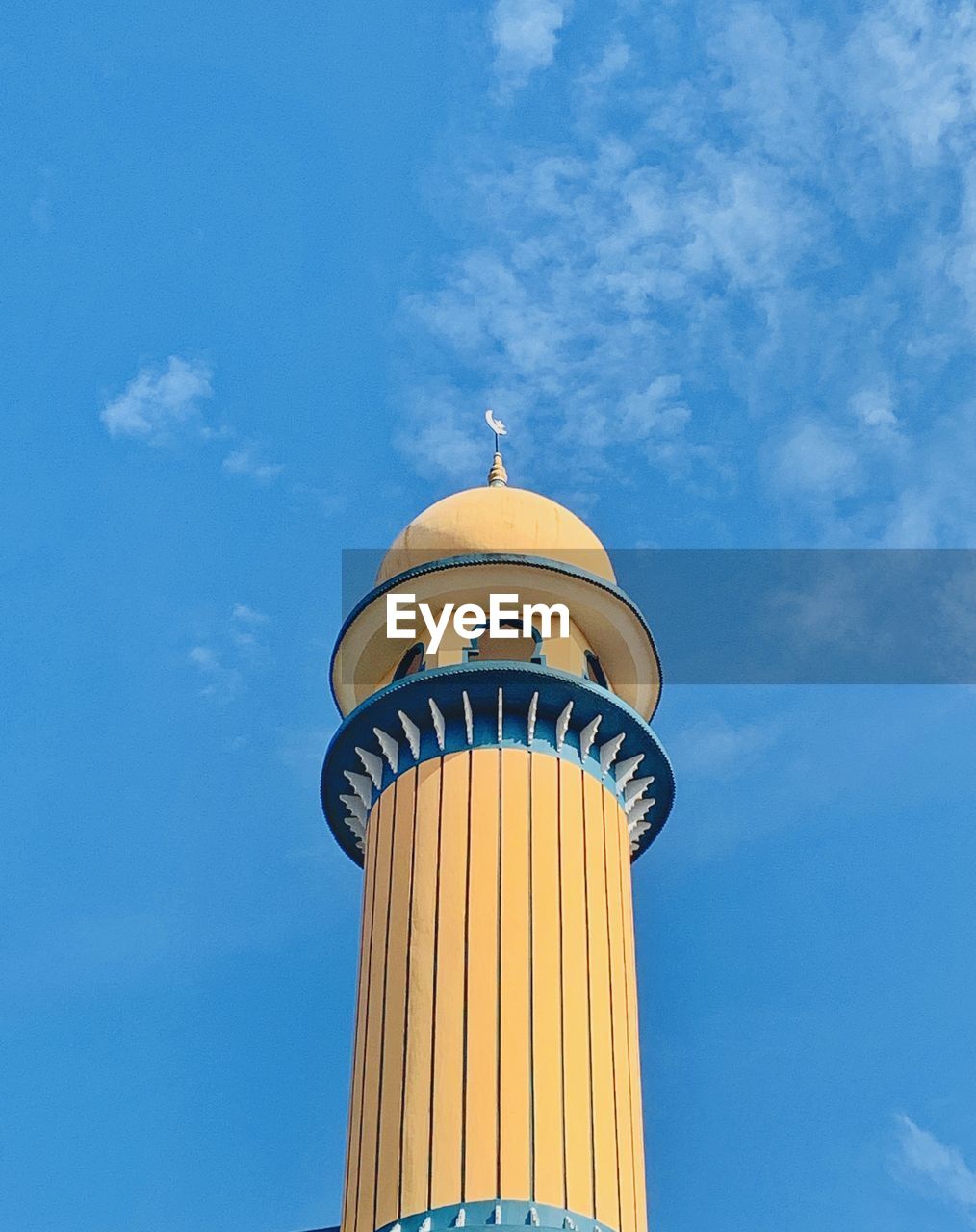 Low angle view of mosque tower against sky