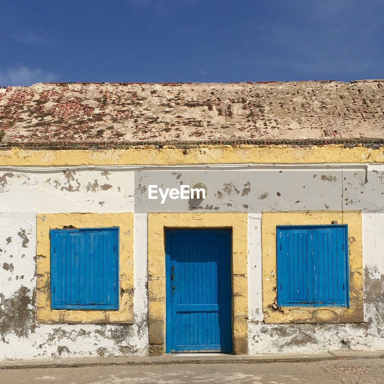 Facade of old house against sky