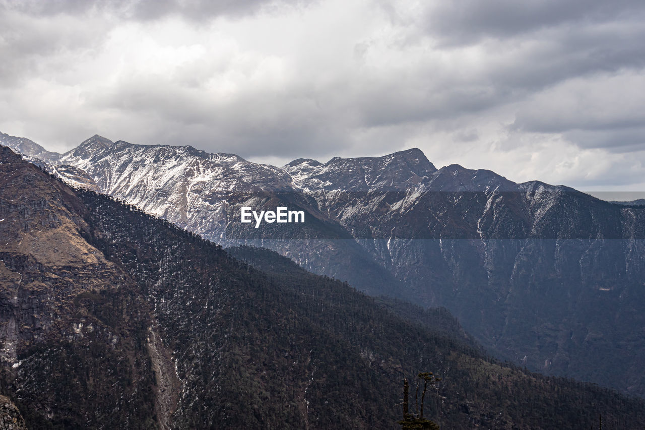 Himalayan mountains covered with light snow at evening