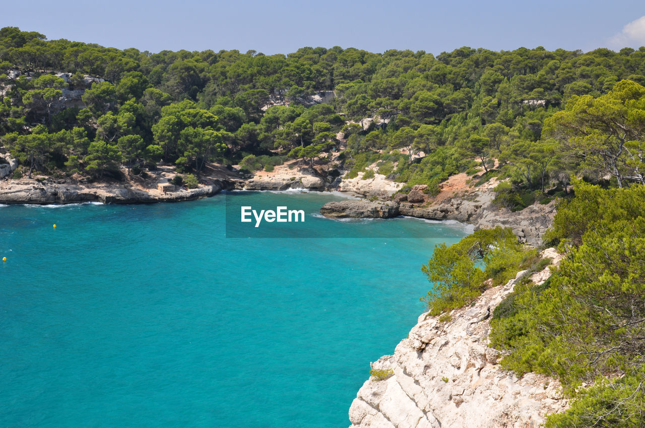 Scenic view of sea with mountain in background