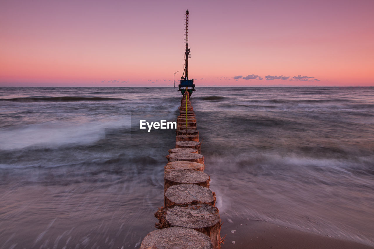 Scenic view of sea against sky during sunup