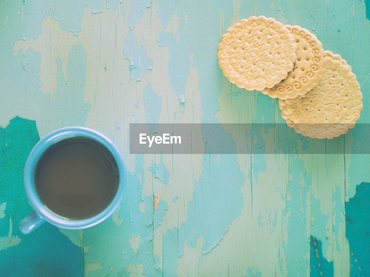 Directly above shot of coffee and cookies on table