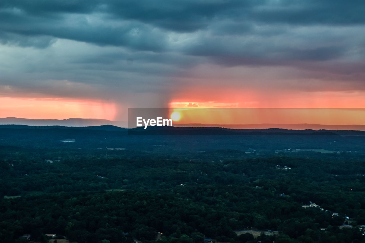 SUNSET OVER LANDSCAPE