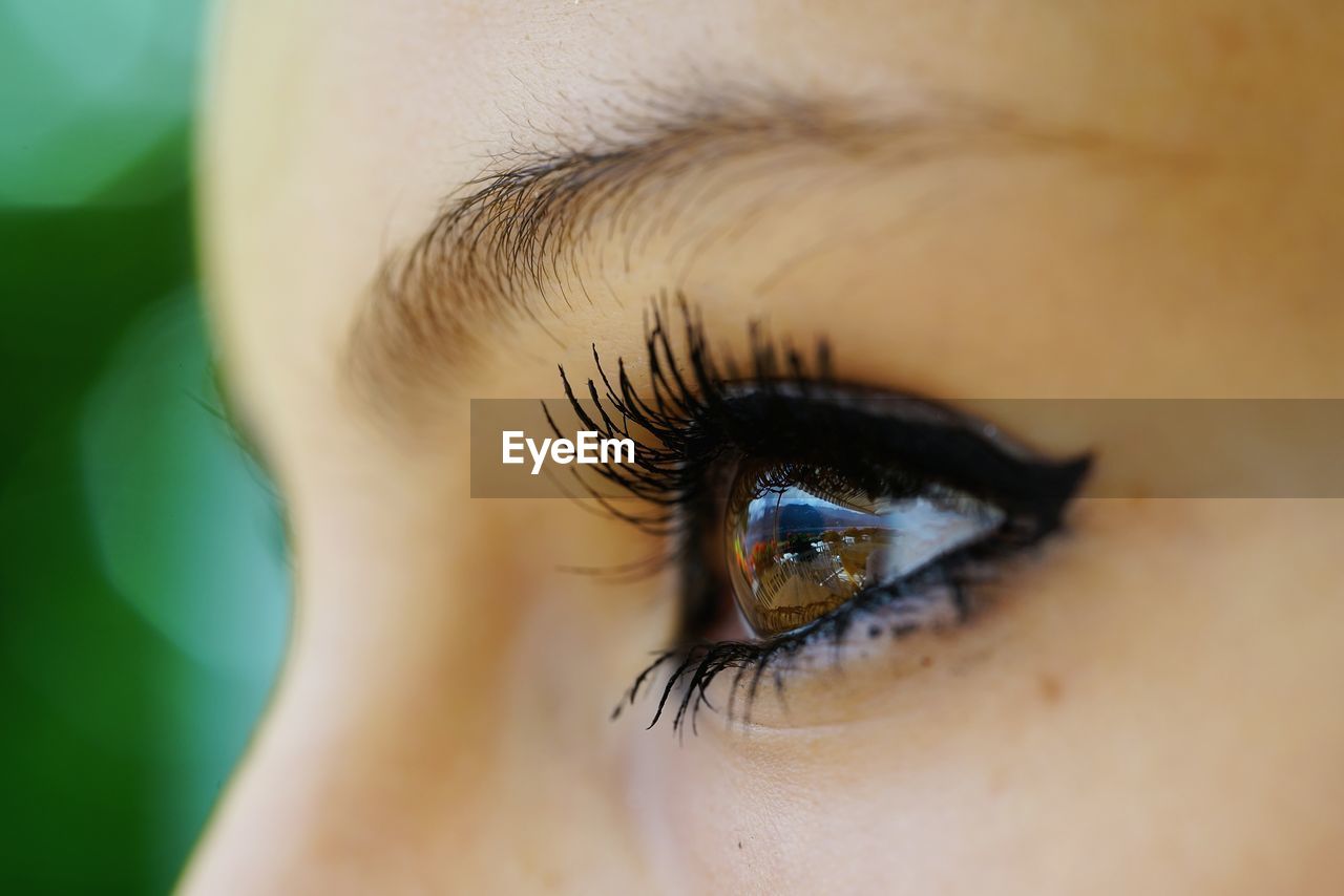 Cropped image of woman looking away