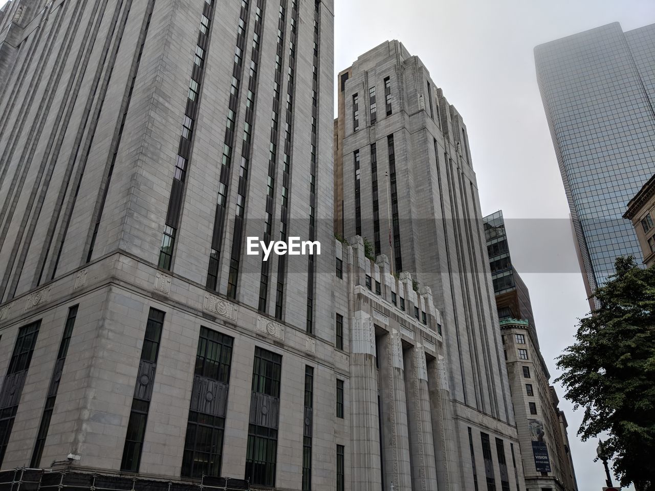 LOW ANGLE VIEW OF MODERN BUILDINGS AGAINST SKY