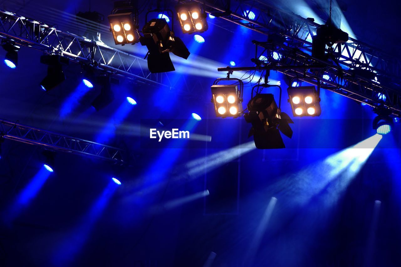 Illuminated stage during concert at night