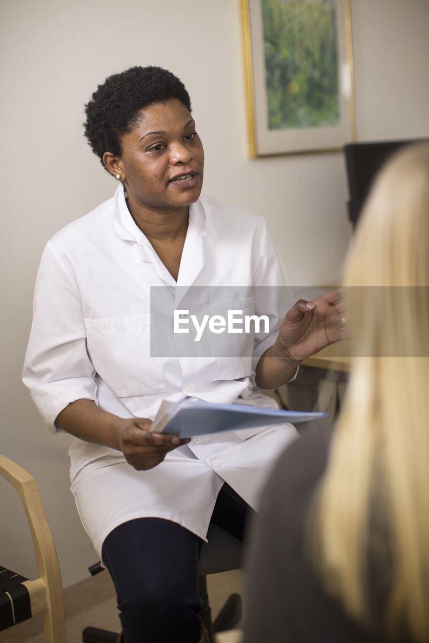 Doctor talking with patient