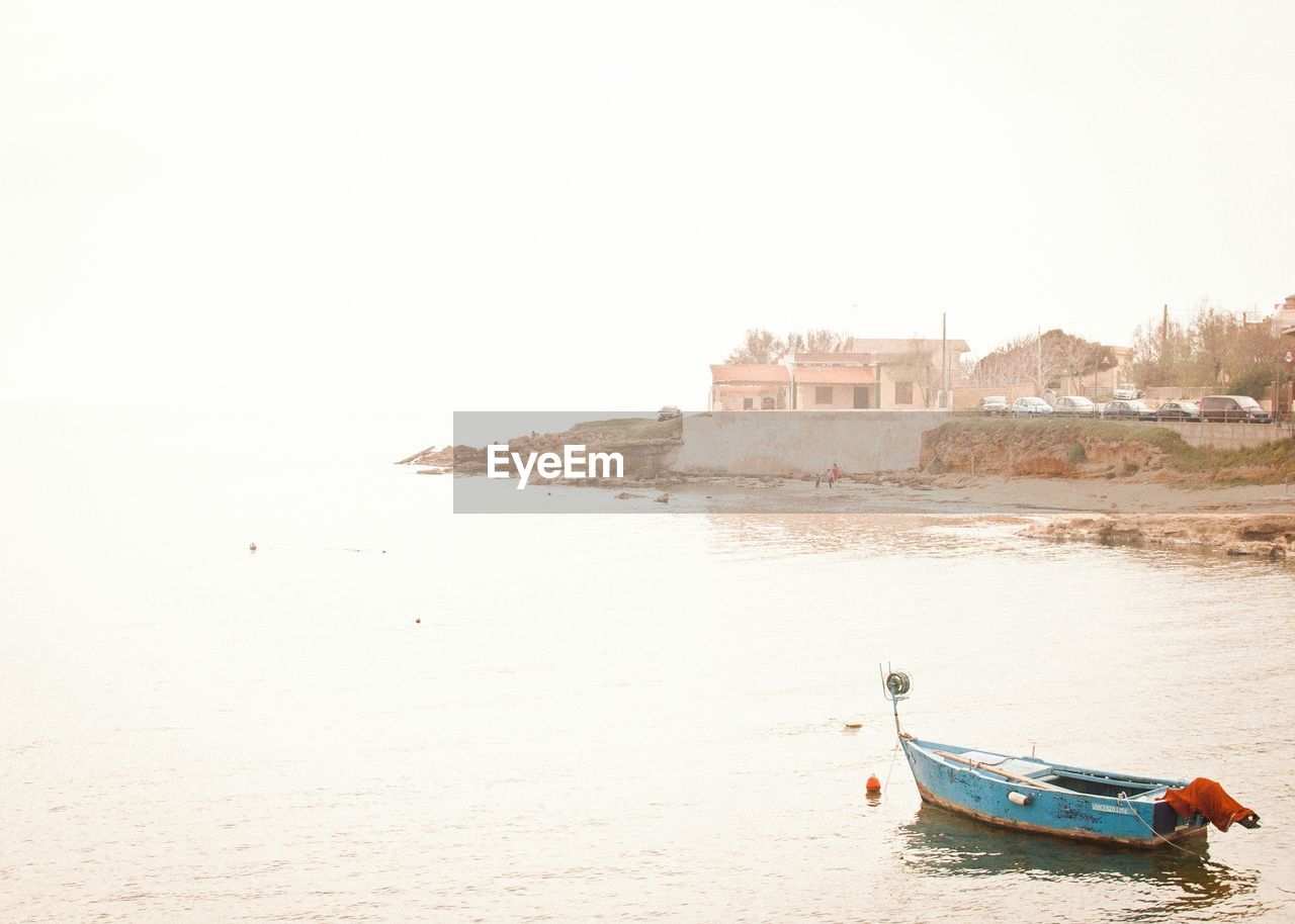 BOATS IN SEA AGAINST CLEAR SKY