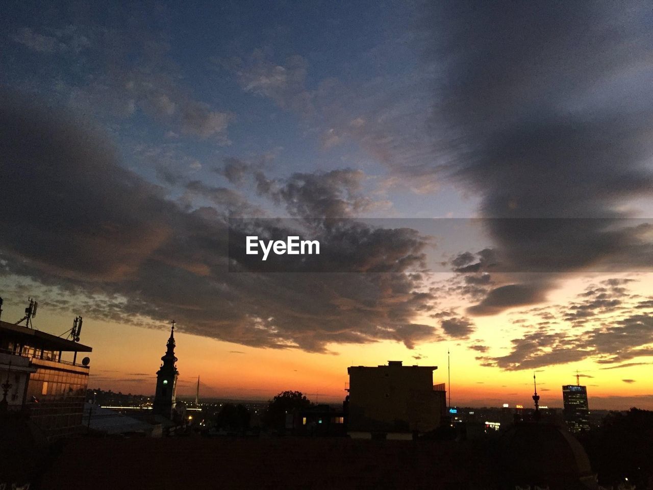 SILHOUETTE OF BUILDINGS AT SUNSET