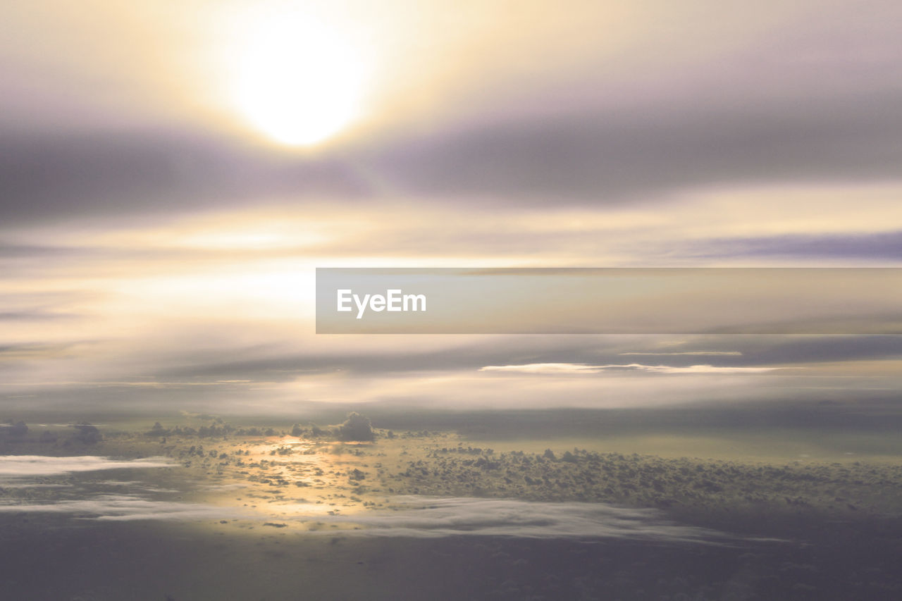 AERIAL VIEW OF LANDSCAPE AGAINST SKY AT SUNSET