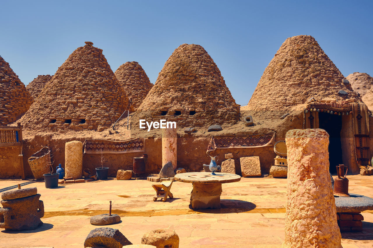 Traditional mud brick made beehive houses. village of beehive houses opposite clear sky