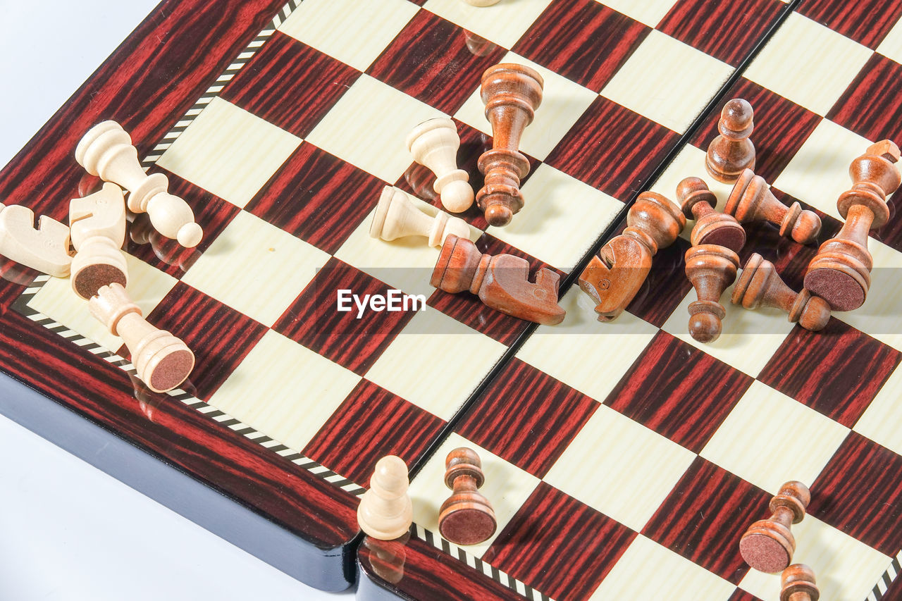 High angle view of chess pieces and board