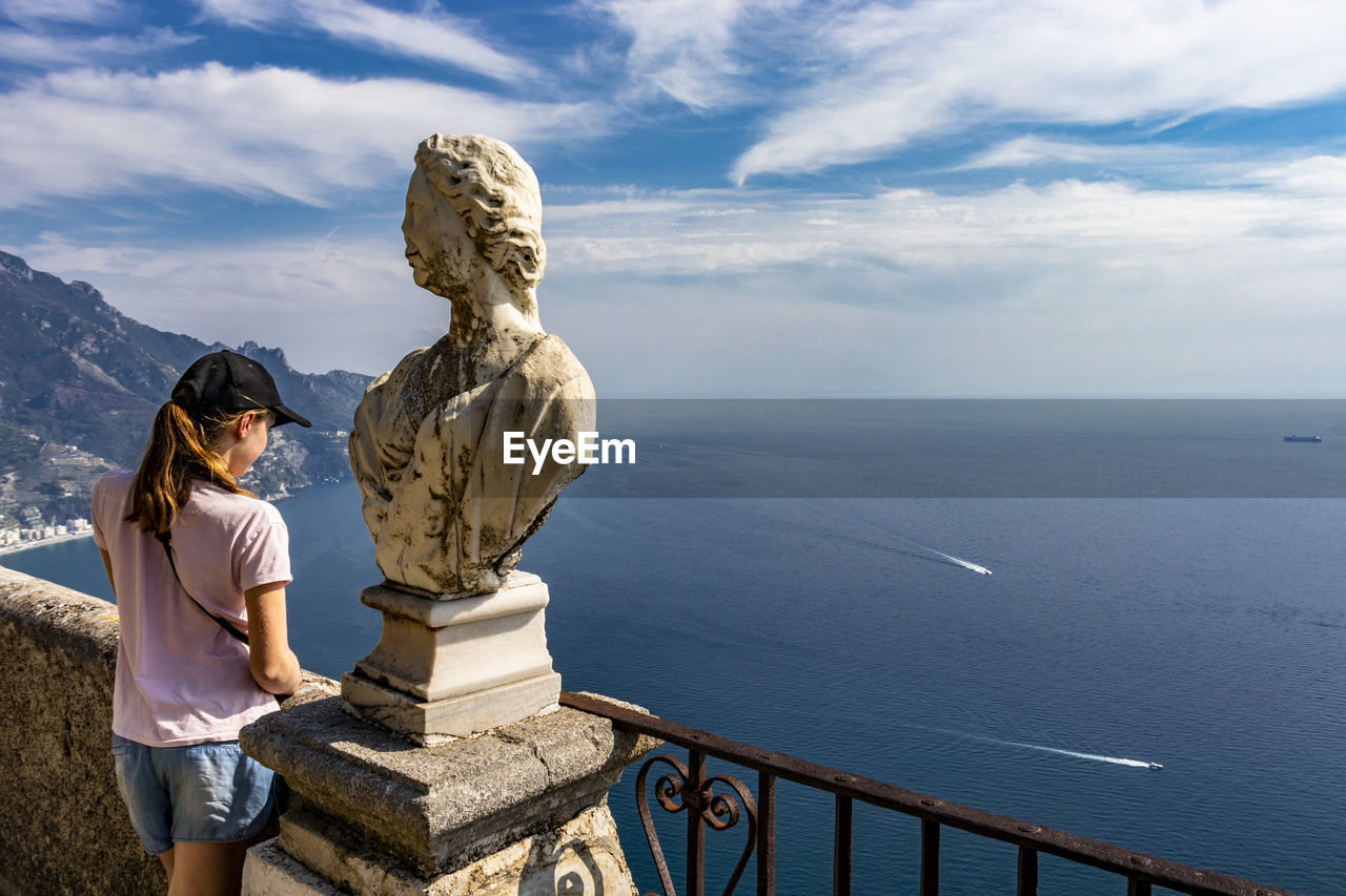 STATUE OF WOMAN LOOKING AT SEA