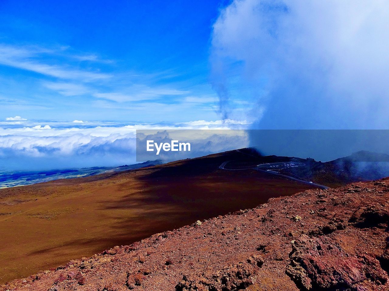 Scenic view of volcanic landscape against sky