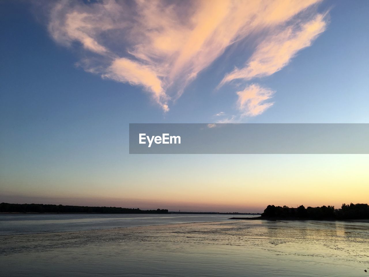 The german river elbe in sunset in the city of wedel, close to hamburg