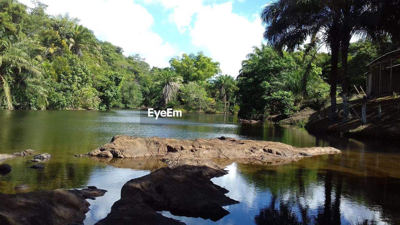 SCENIC VIEW OF LAKE AGAINST ROCKS