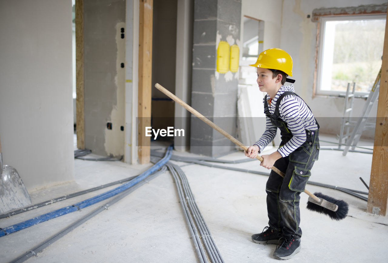 side view of man working in factory