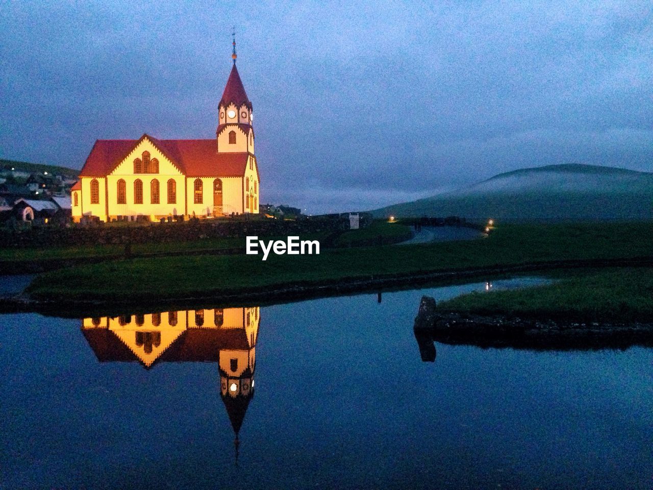 REFLECTION OF BUILDINGS IN WATER