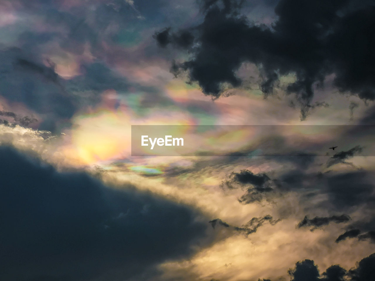 LOW ANGLE VIEW OF RAINBOW IN SKY DURING SUNSET