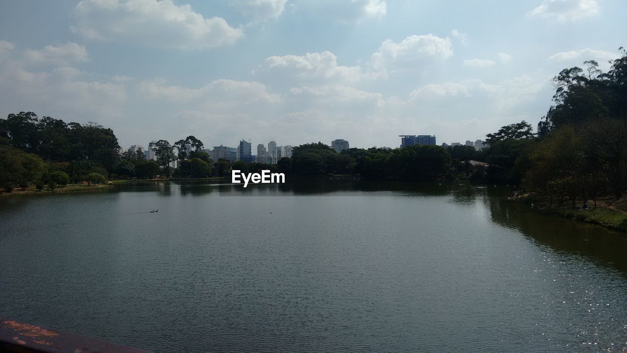 RIVER WITH BUILDINGS IN BACKGROUND