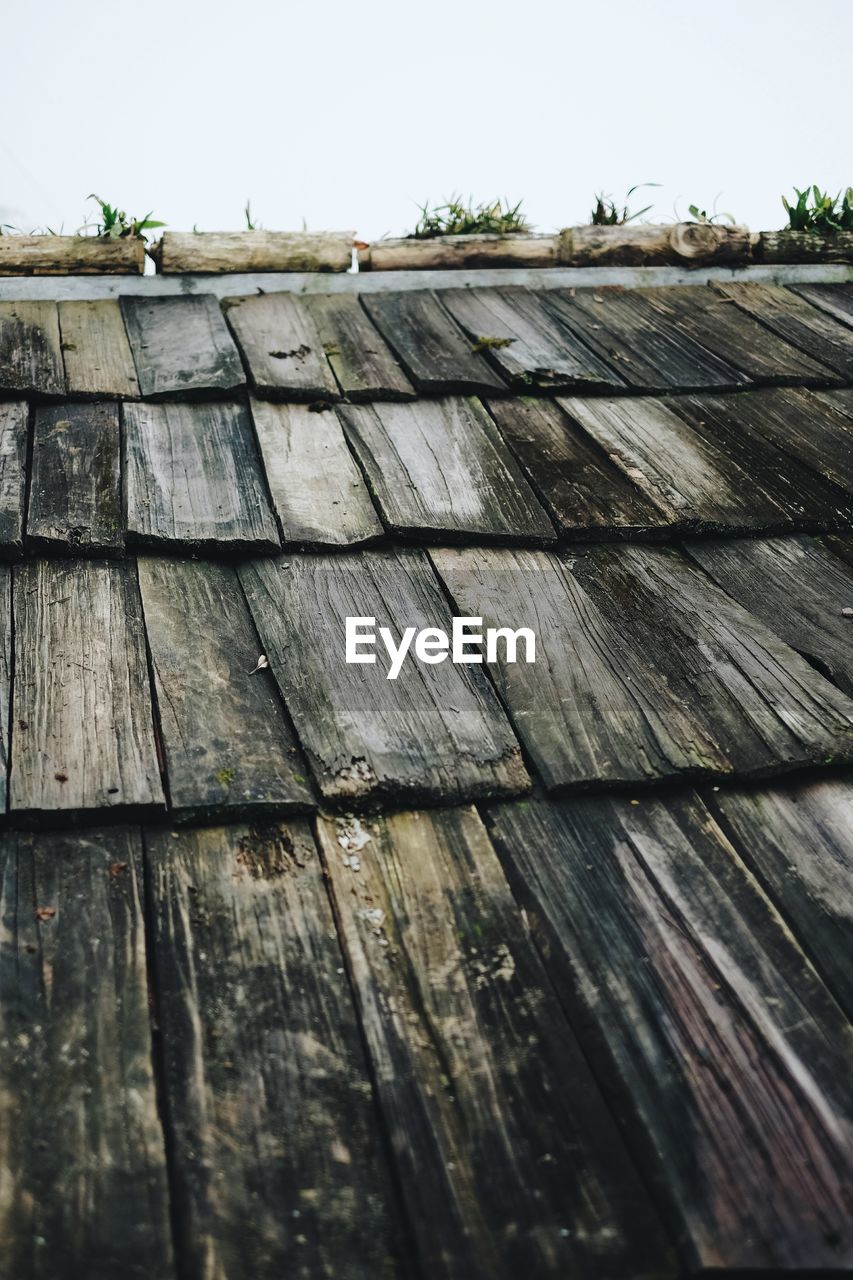 Low angle view of wooden roof against sky