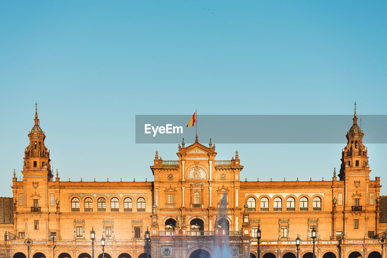 View of historic building against clear blue sky