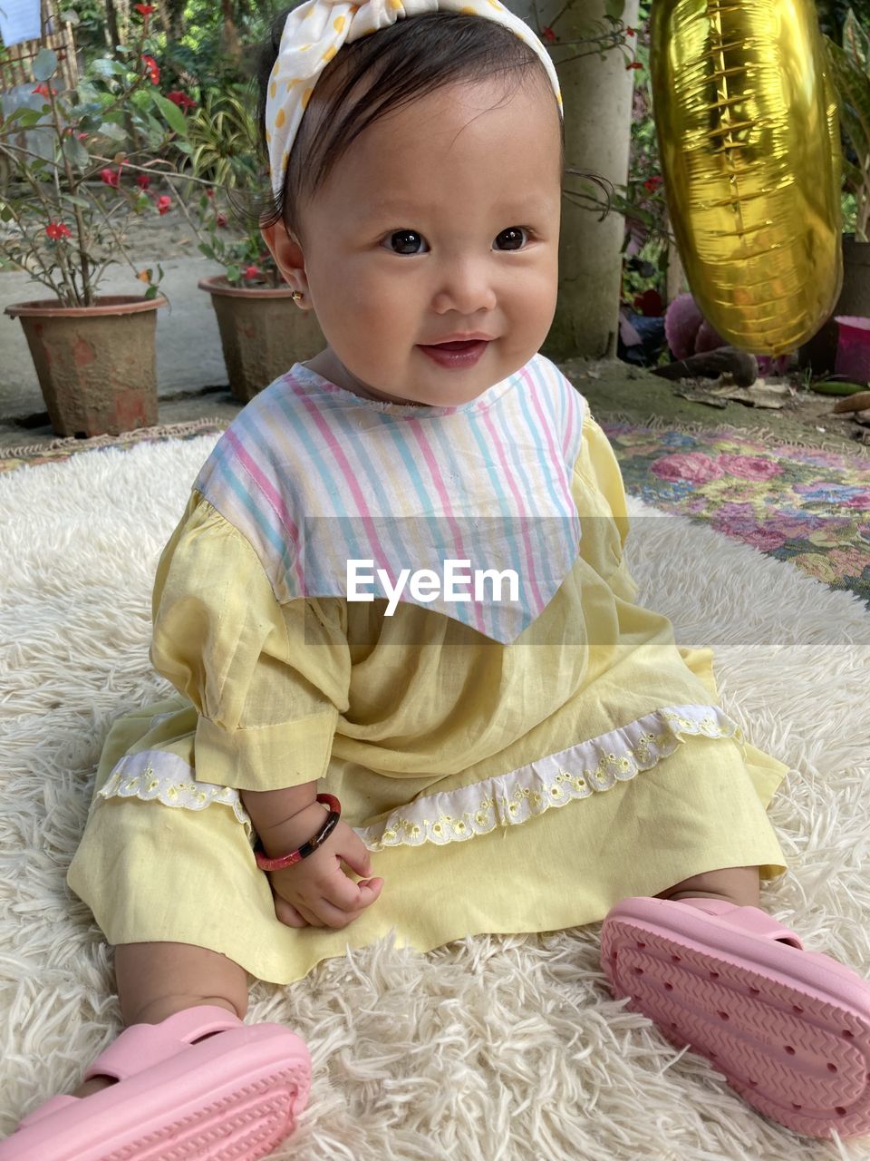 Cute baby girl in yellow