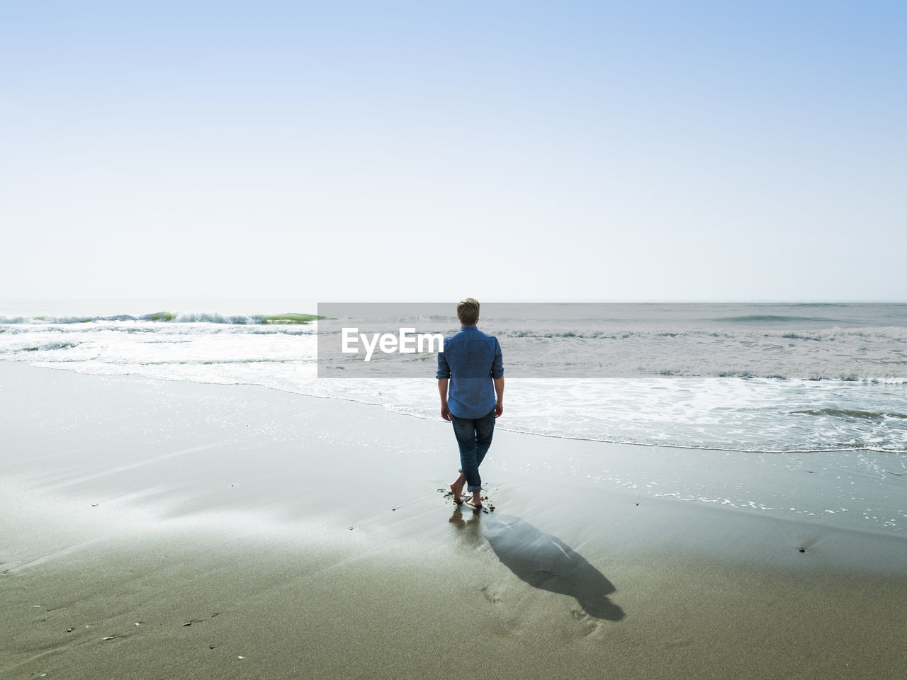 Man on the beach, bajondillo beach, torremolinos, malaga, spain