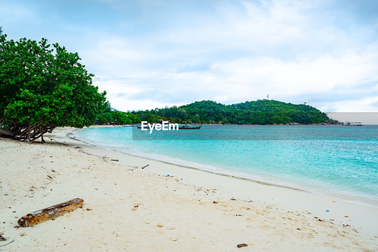 SCENIC VIEW OF SANDY BEACH AGAINST SKY