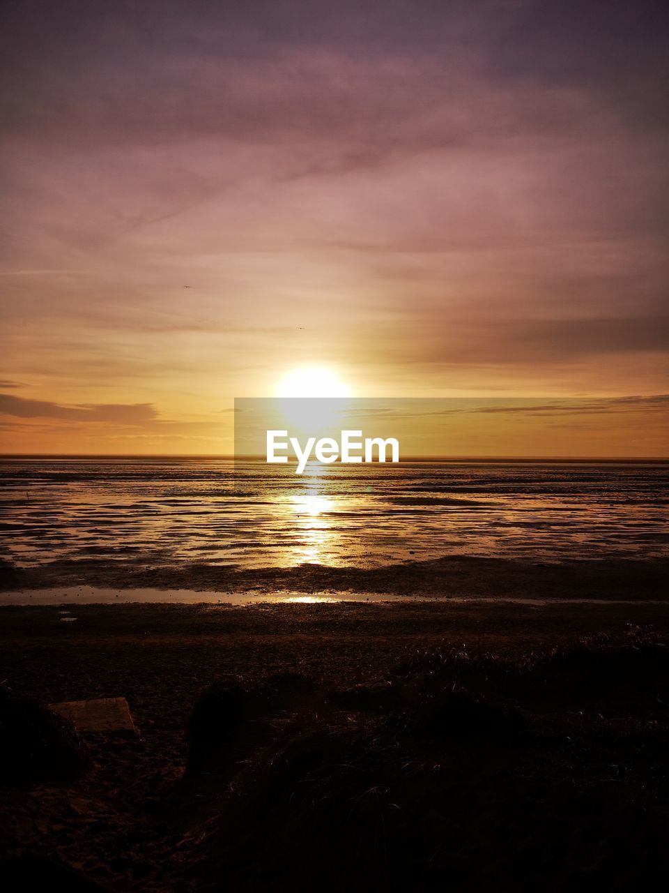 SCENIC VIEW OF SEA DURING SUNSET