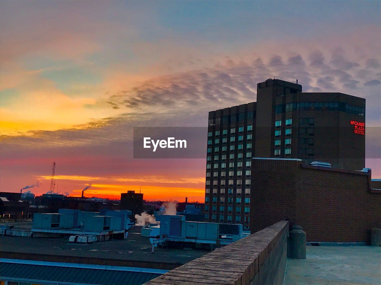 Cityscape against sky during sunset