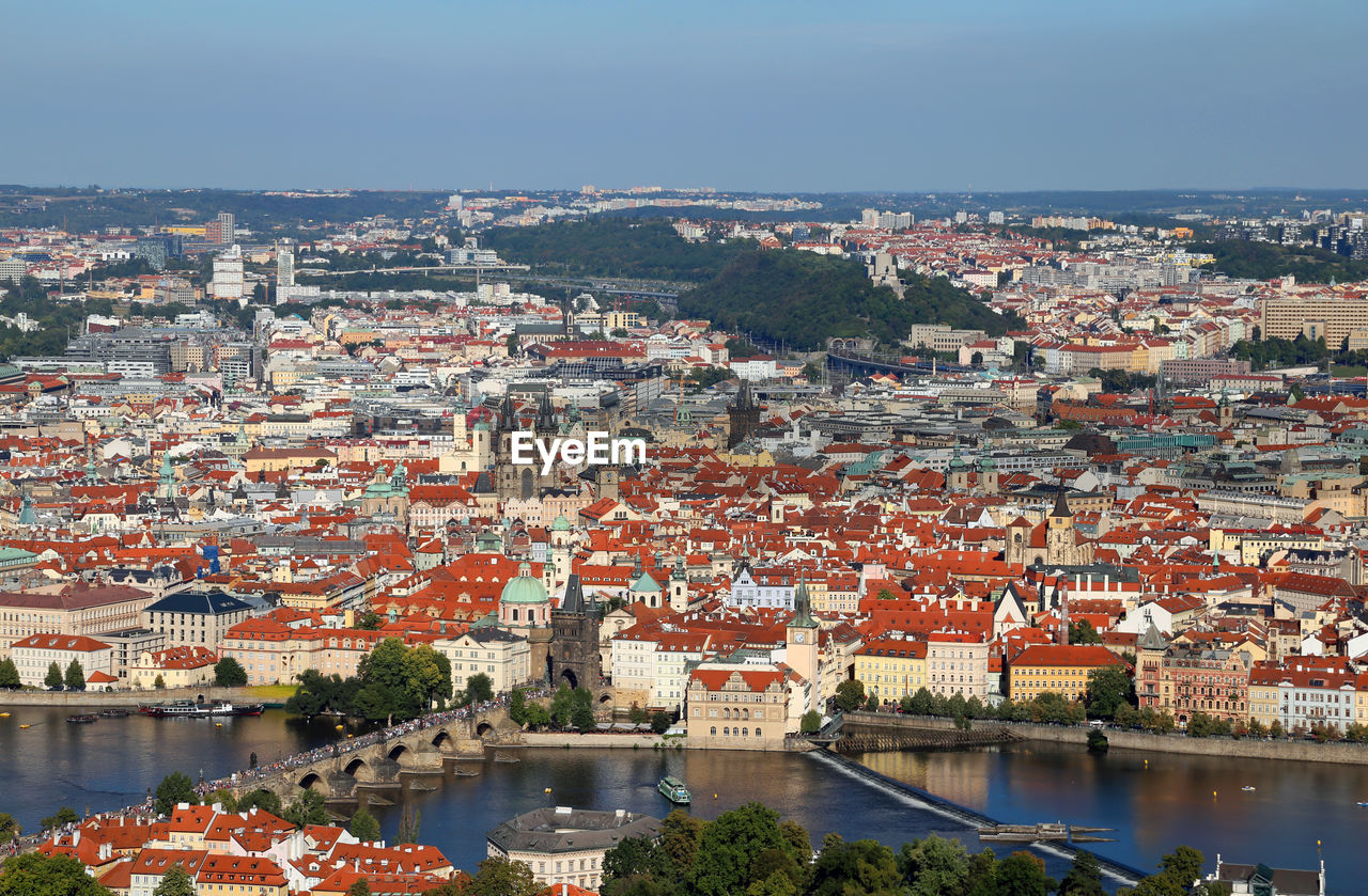 High angle view of river in town against sky