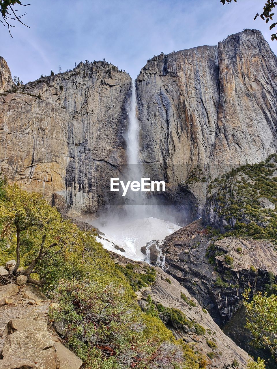 Upper yosemite falls in the spring with lingering winter snow at yosemite national park