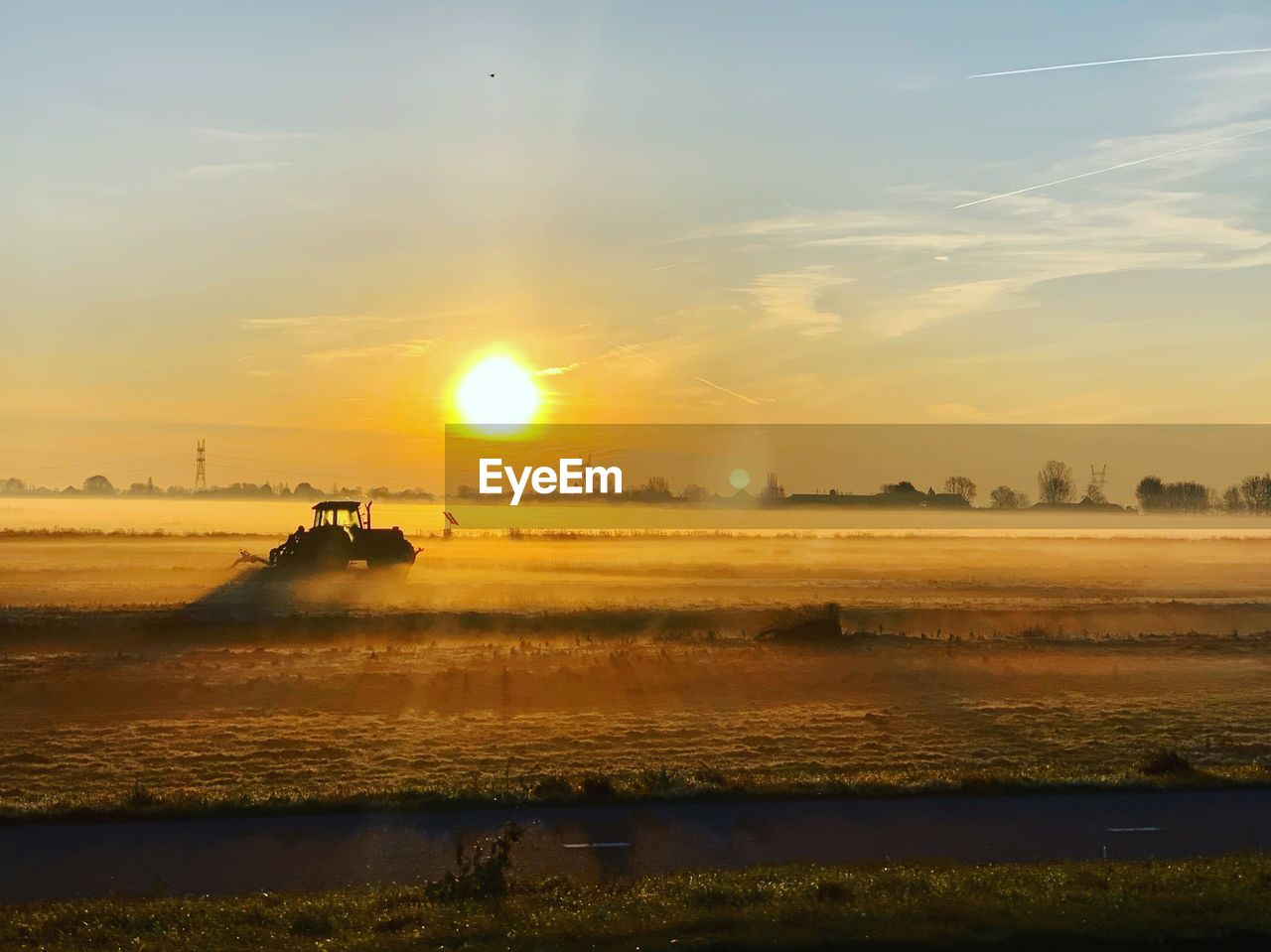 Scenic view of field against sky during sunset