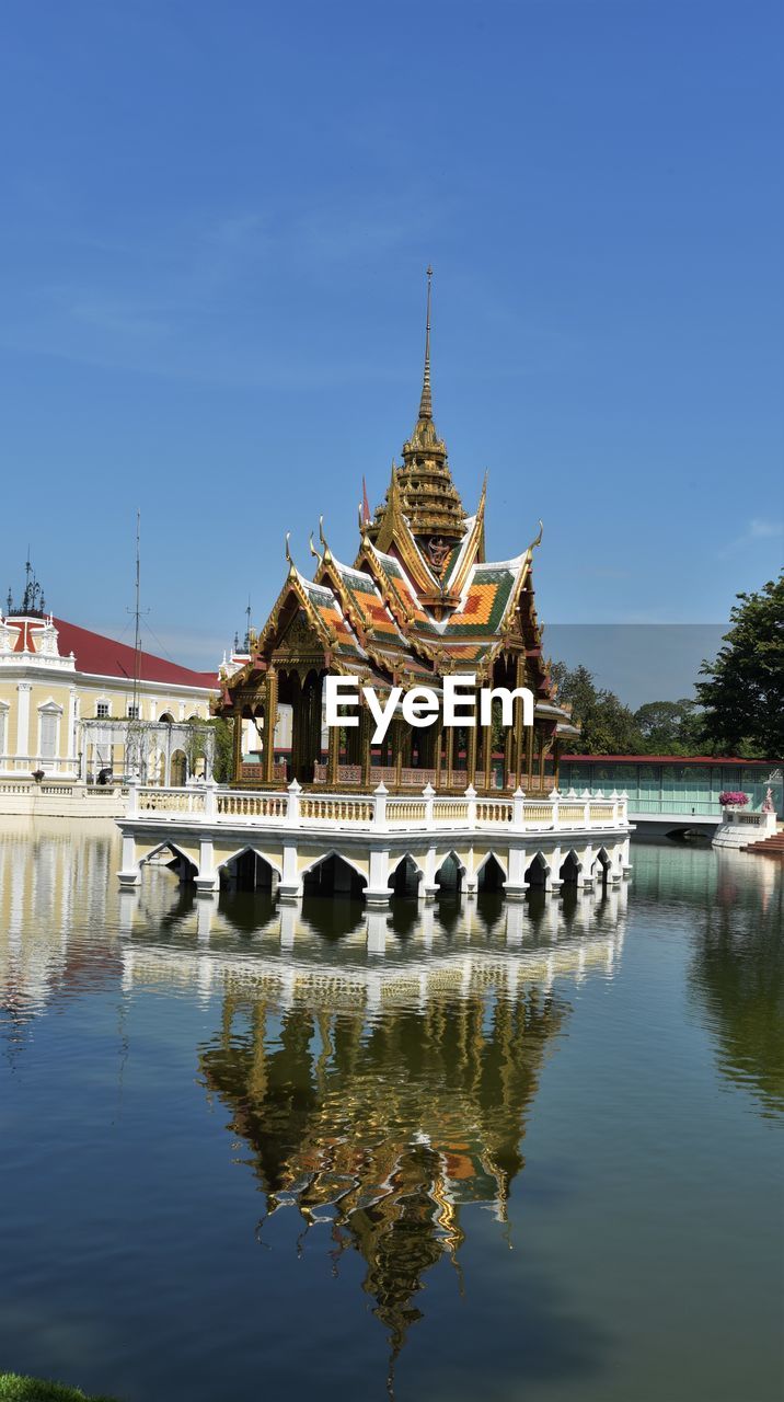 Reflection of traditional building in lake