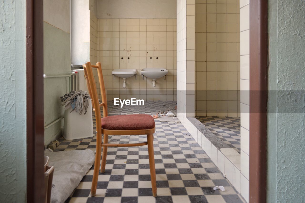 Empty chair in bathroom