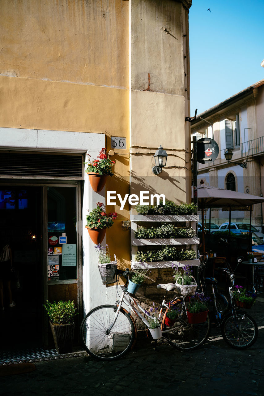 BICYCLES PARKED OUTSIDE BUILDING