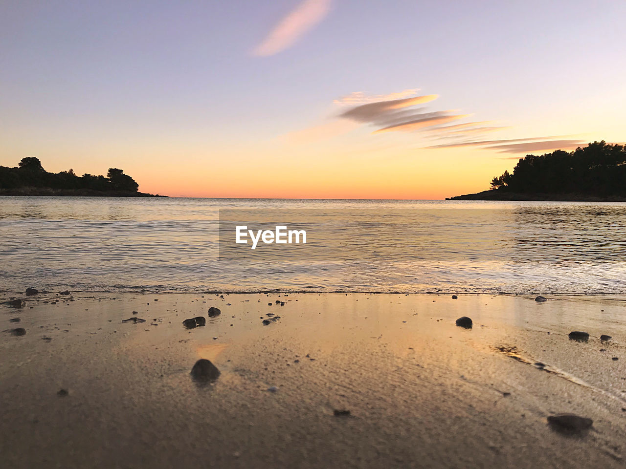 Scenic view of sea against sky during sunset