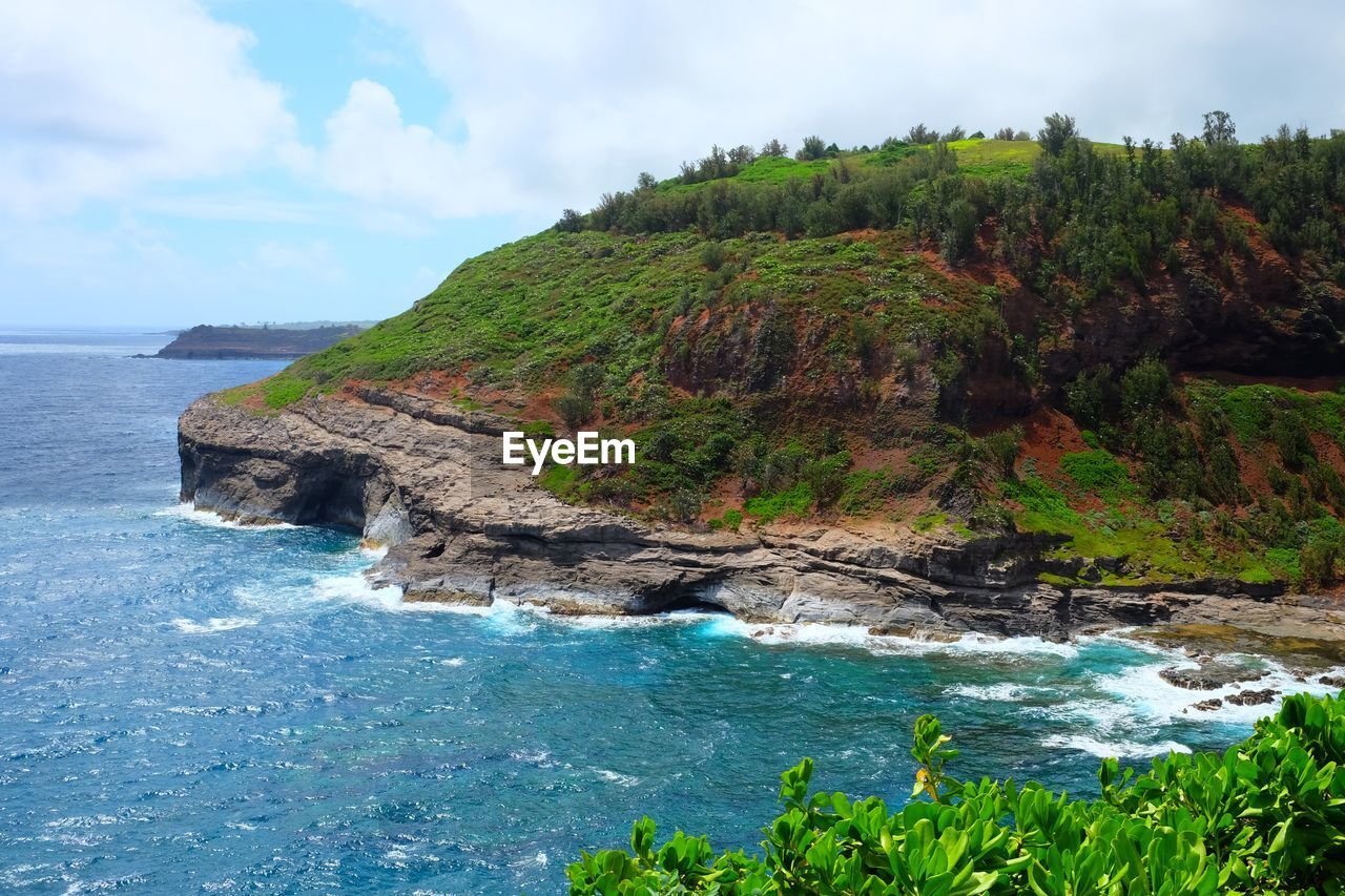 SCENIC VIEW OF SEA BY CLIFF AGAINST SKY