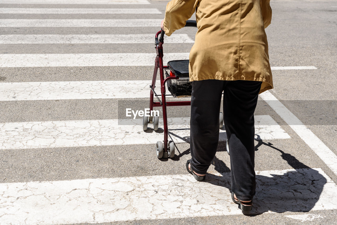 LOW SECTION OF MAN CROSSING ROAD