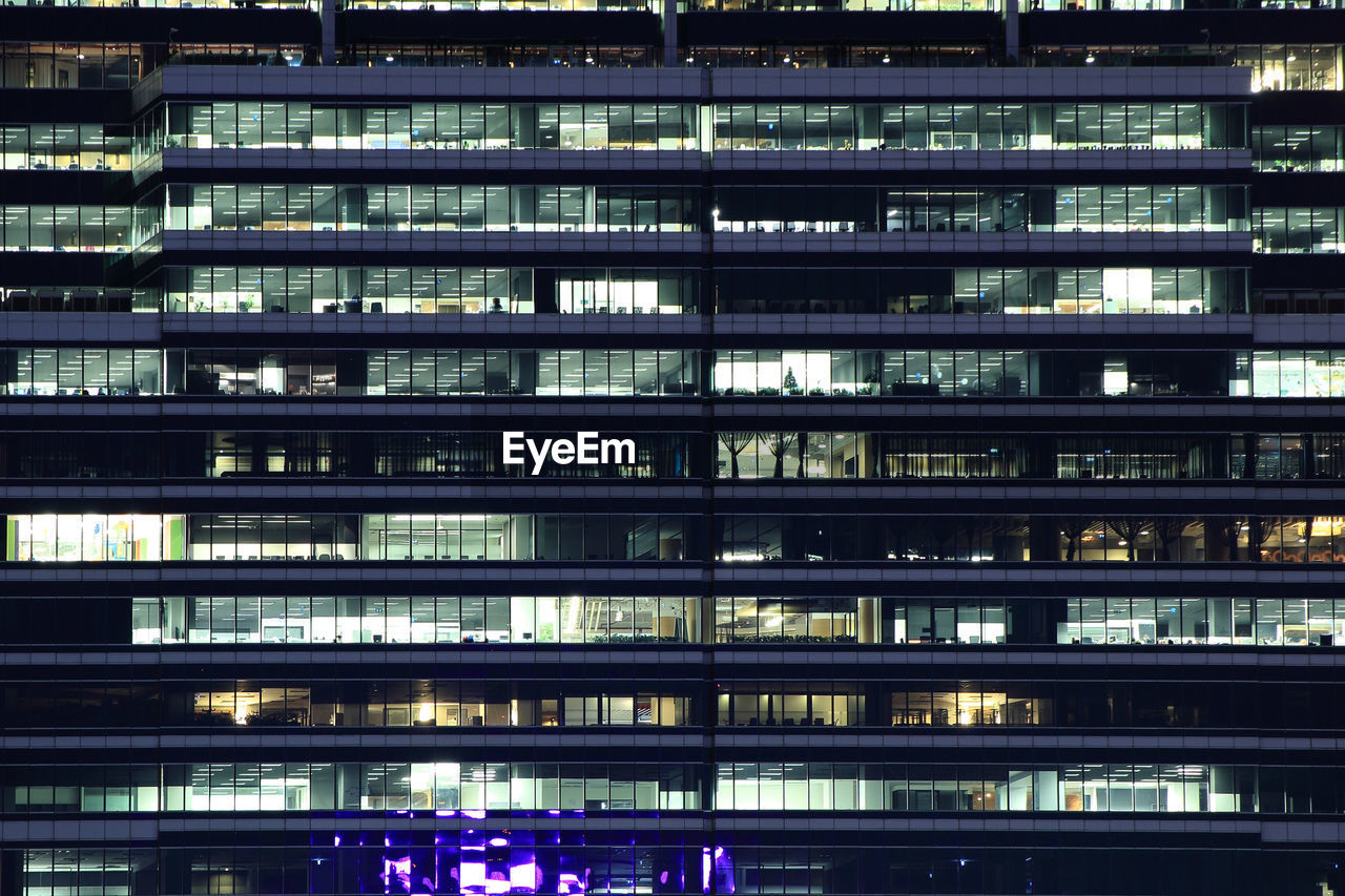 Office building at night. glass curtain wall office building.