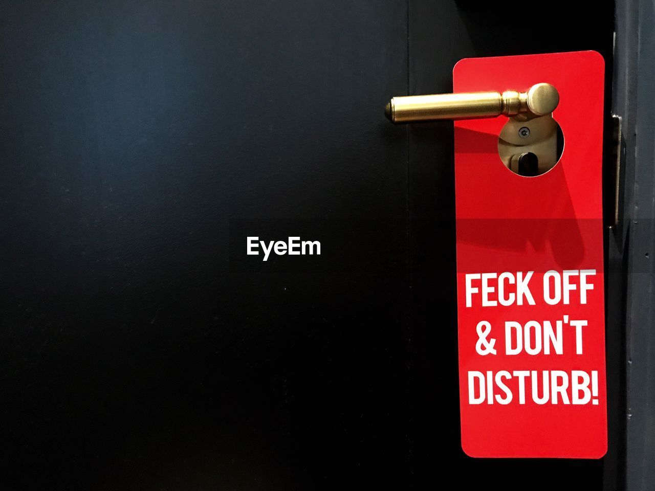 Close-up of do not disturb sign on door