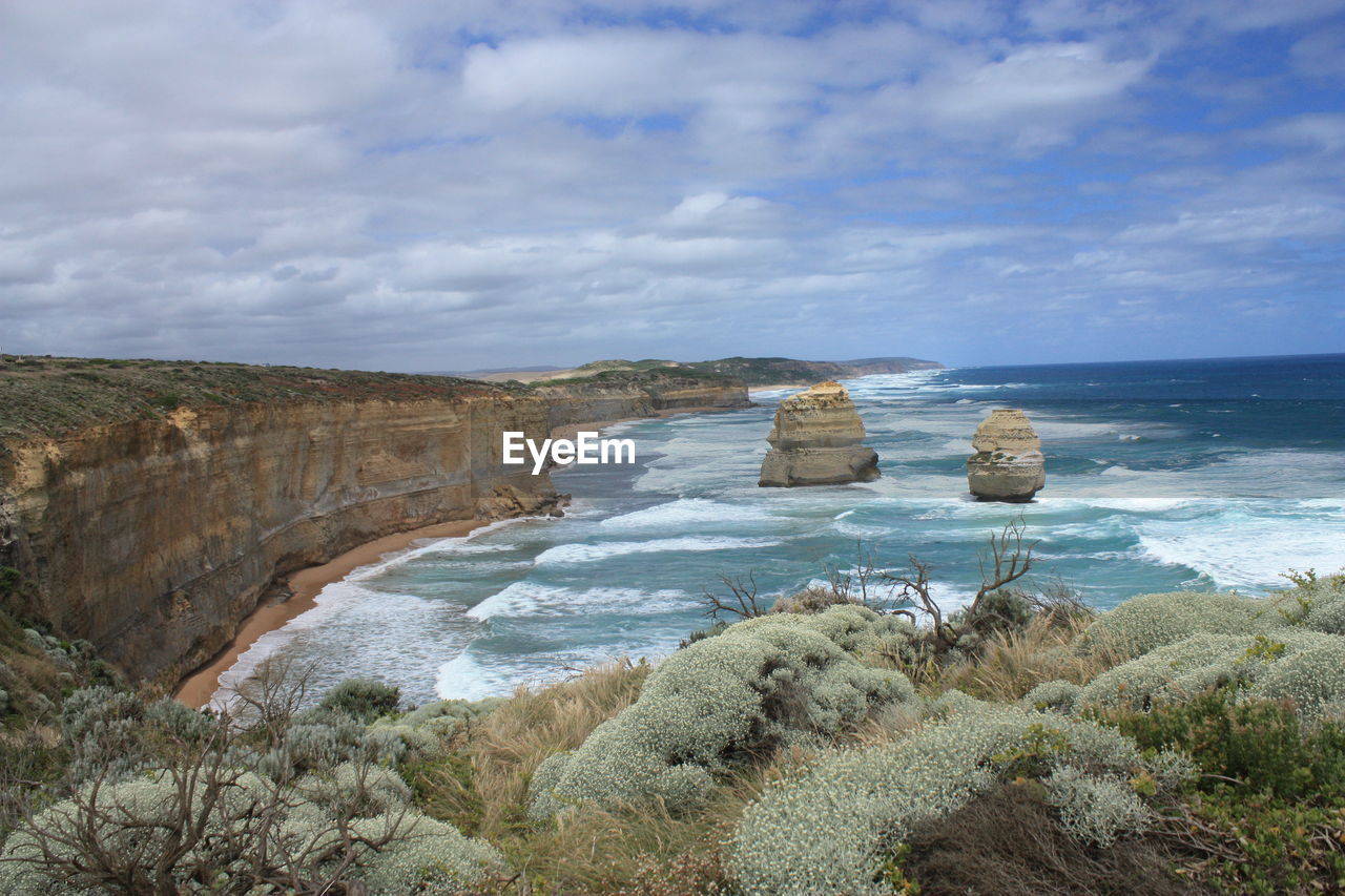 SCENIC VIEW OF SEA AND CLIFF AGAINST SKY