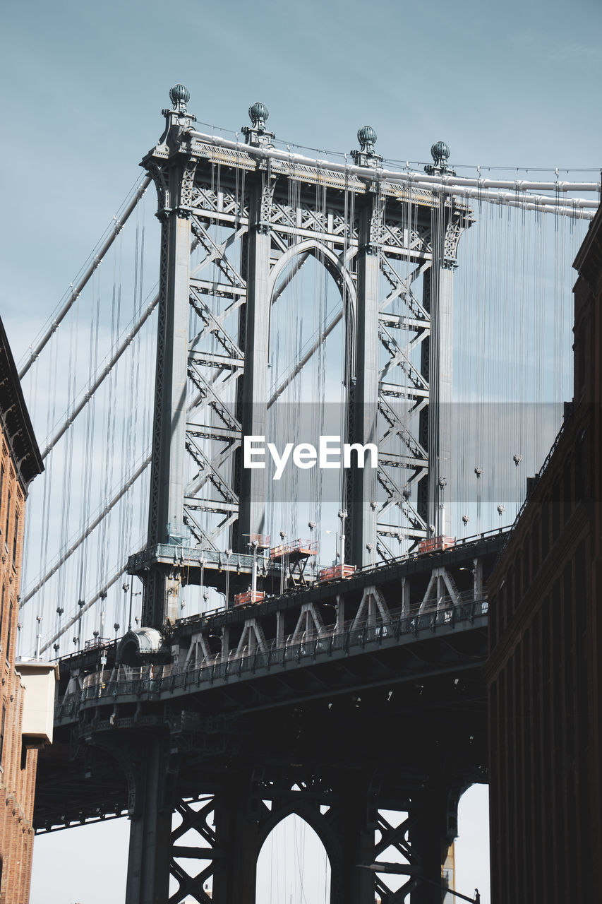 A vertical shot of the manhattan bridge in new york city, usa