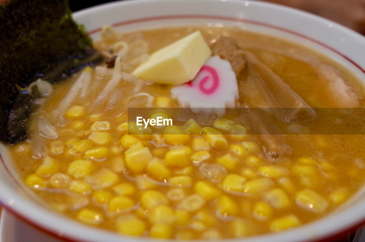 CLOSE-UP OF SOUP IN BOWL WITH SAUCE