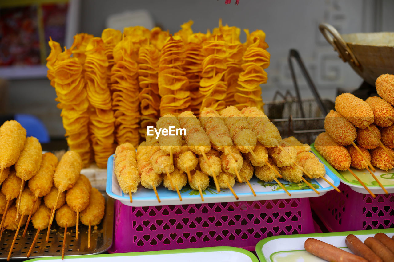 Closeup of fried sweet potato and fried spiral potato in the market