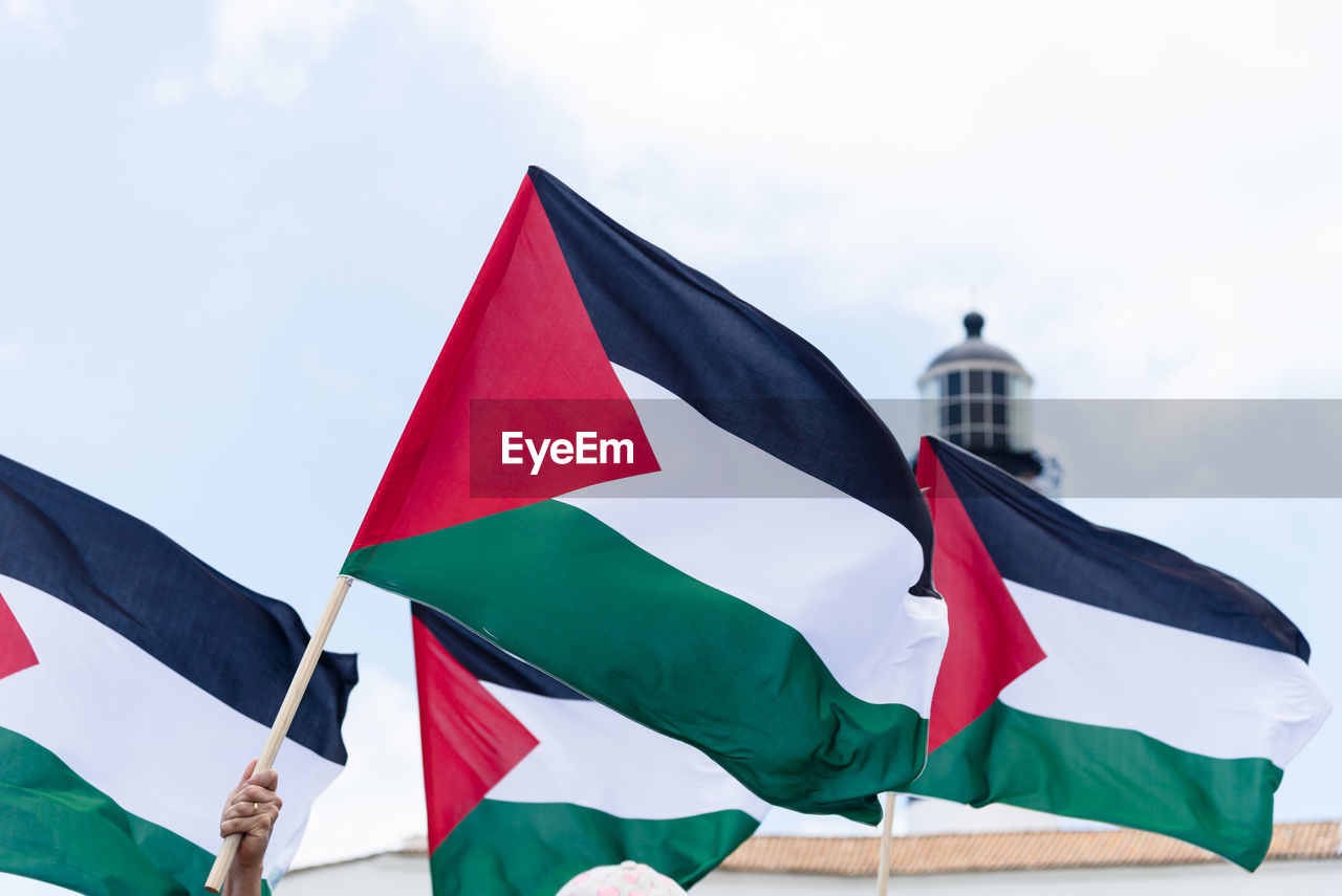 Protesters are seen holding the palestinian flag during a peaceful protest 