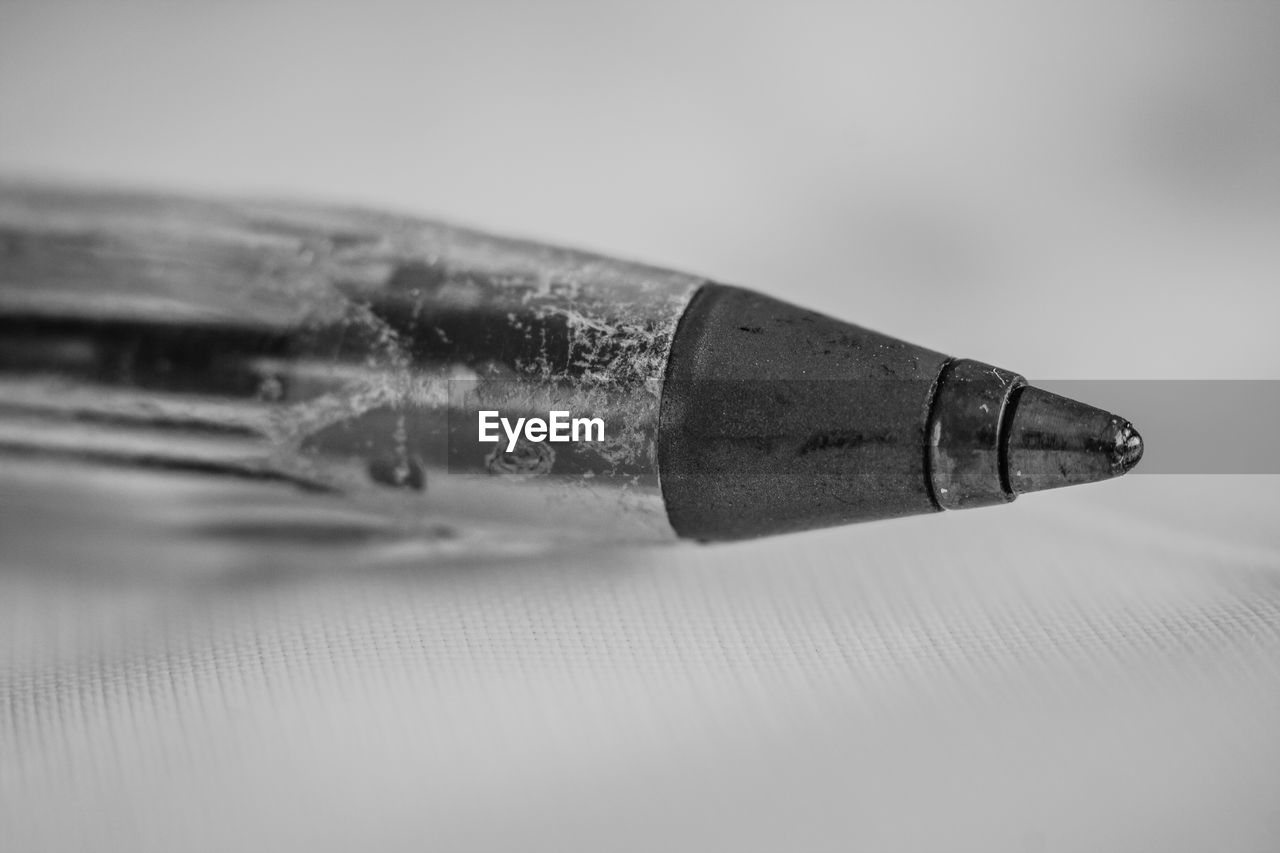 Close-up of ballpoint pen on table